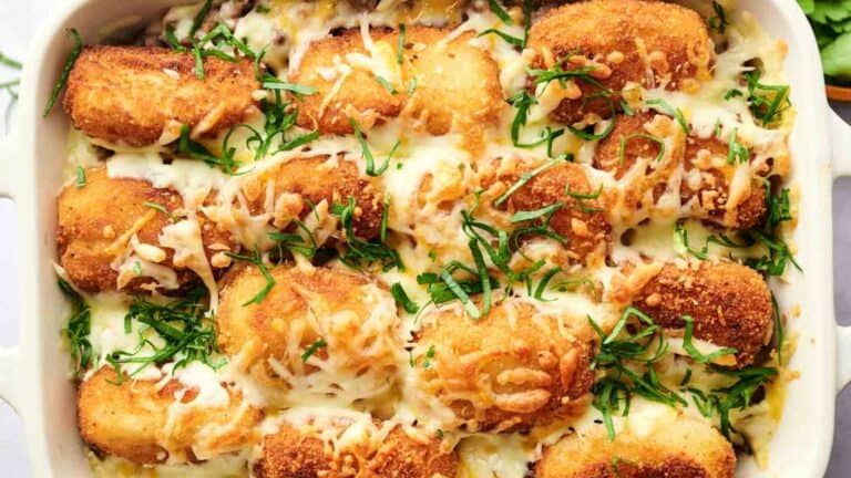 A tater tot casserole dish filled with cheesy breadsticks.