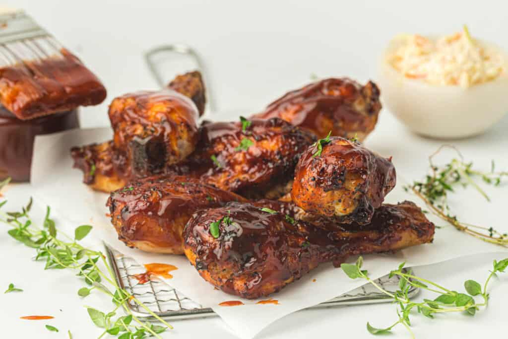 A plate of BBQ chicken wings cooked in an air fryer.