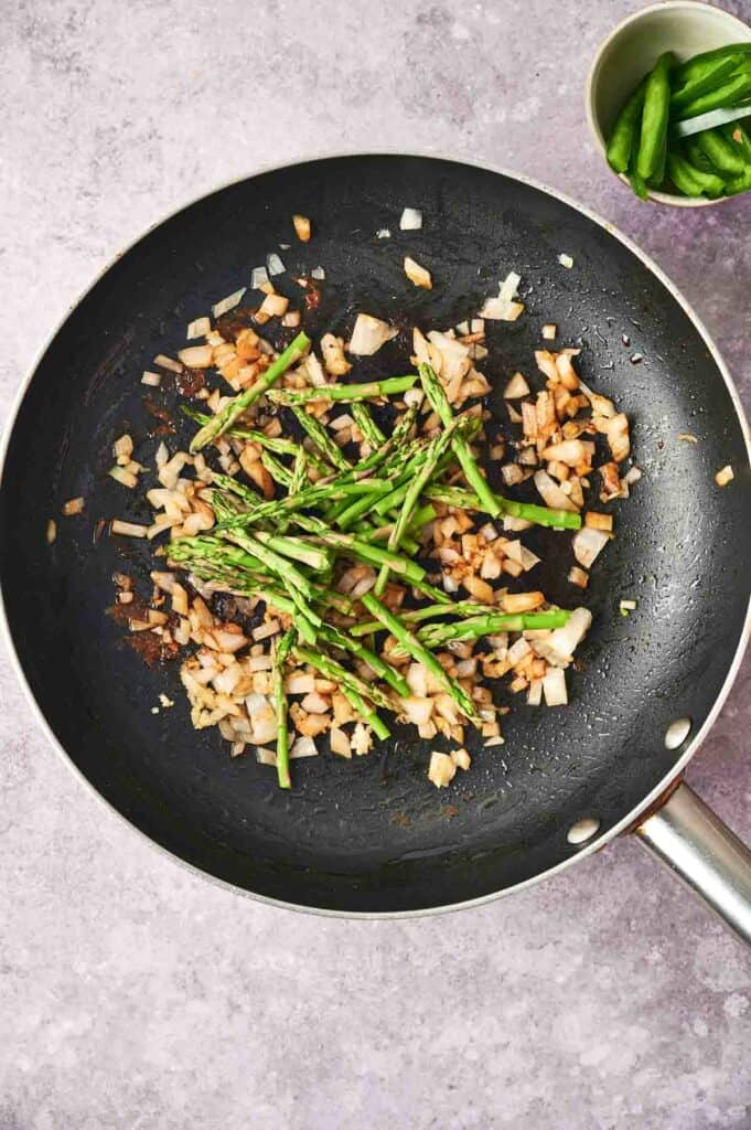 A pan of vegetables and onions for Chipotle Pasta.