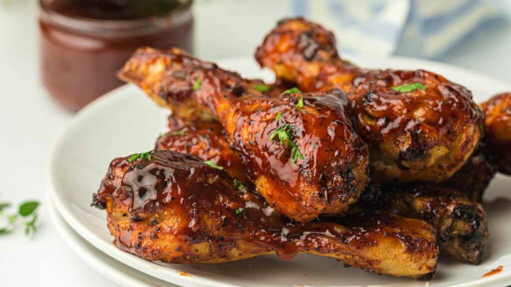 Air fryer BBQ chicken wings on a white plate.
