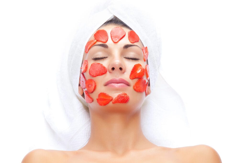 A woman with red roses on her face.