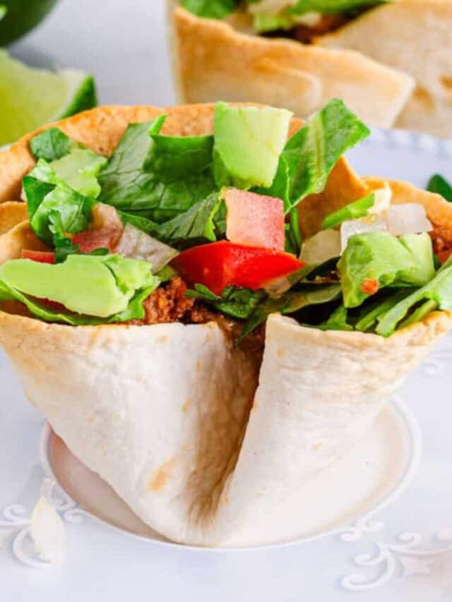 Mexican taco salad cups on a plate.