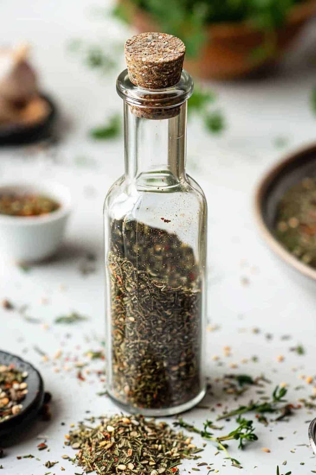 A bottle of spices with a cork.