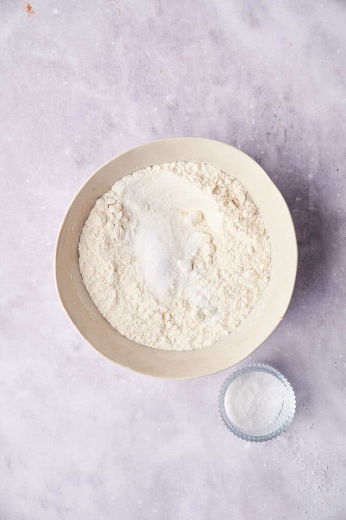 A bowl with dry ingredients for a barrel chicken and dumplings soup.