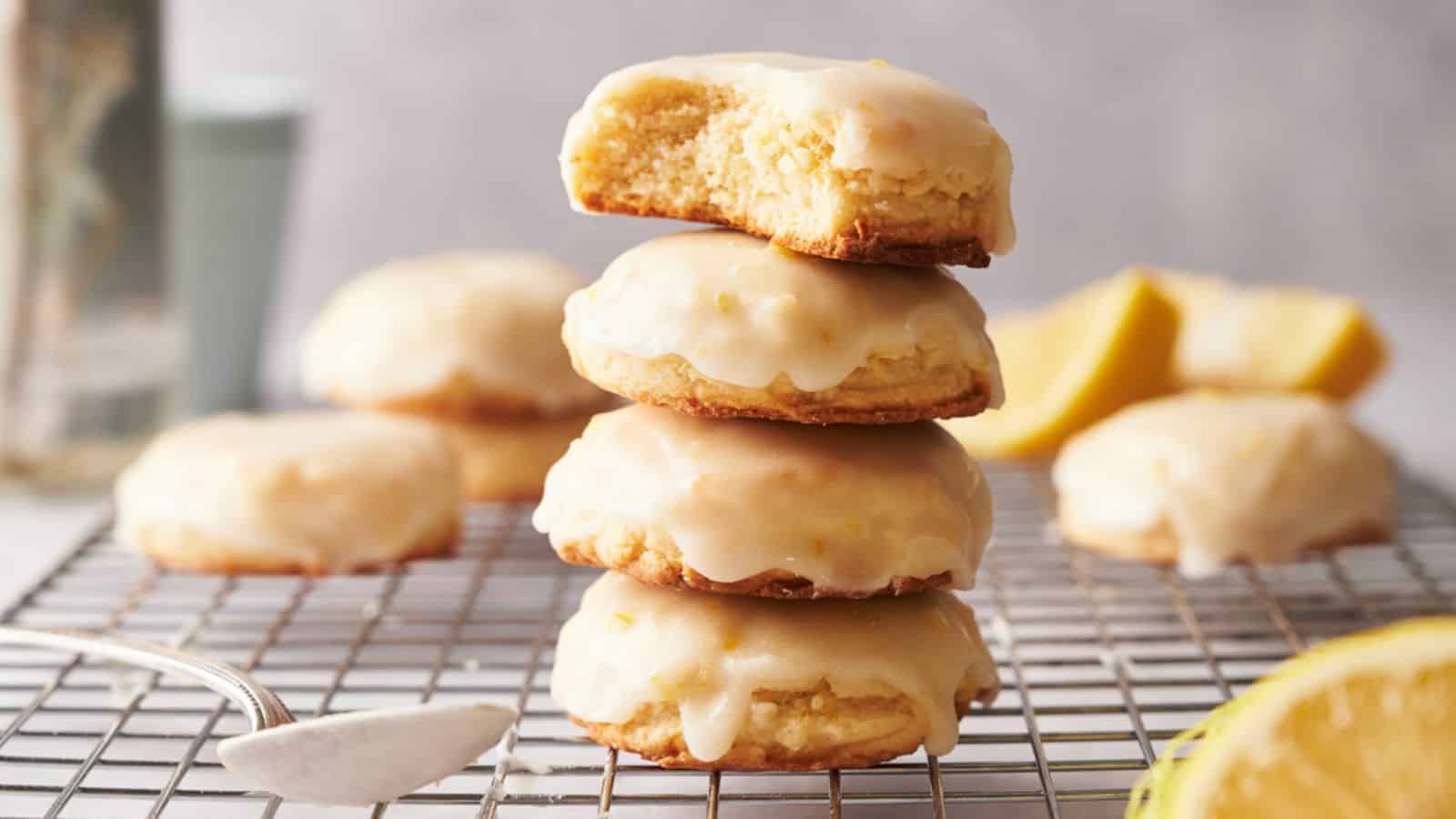 A stack of lemon cookies on a cooling rack.