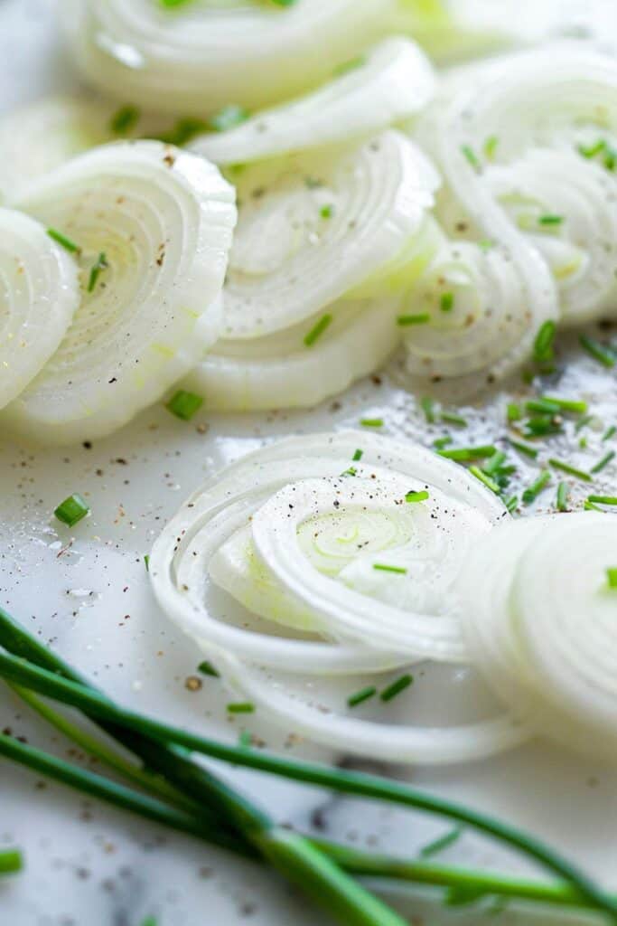 Sliced onions with chives and seasonings.