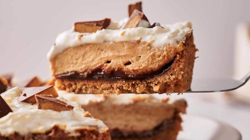 A slice of Reese's pie sits on a cake slice, ready to be served.
