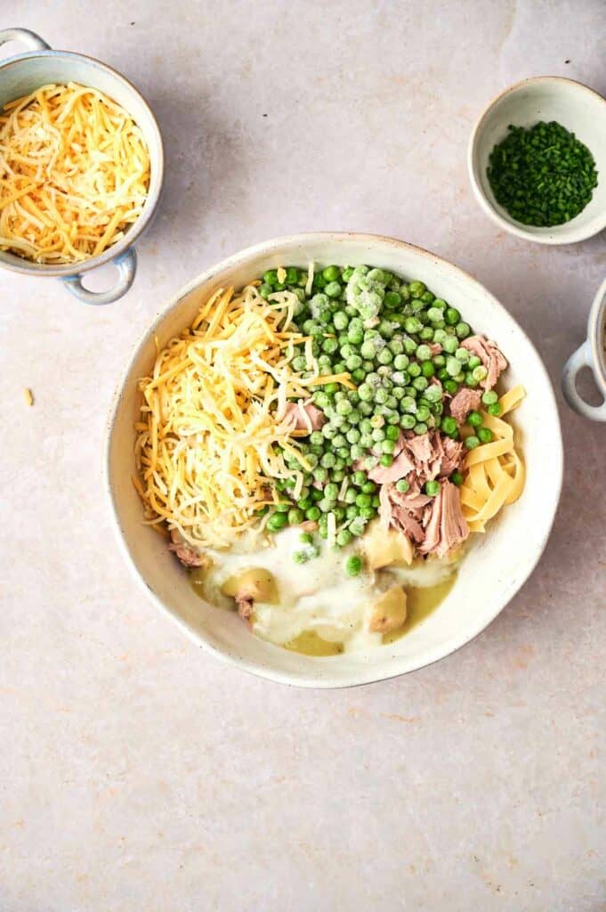 tuna casserole ingredients mixed in a bowl