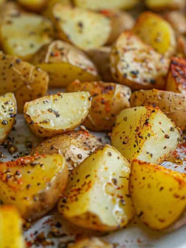 Roasted potatoes seasoned with herbs and spices.
