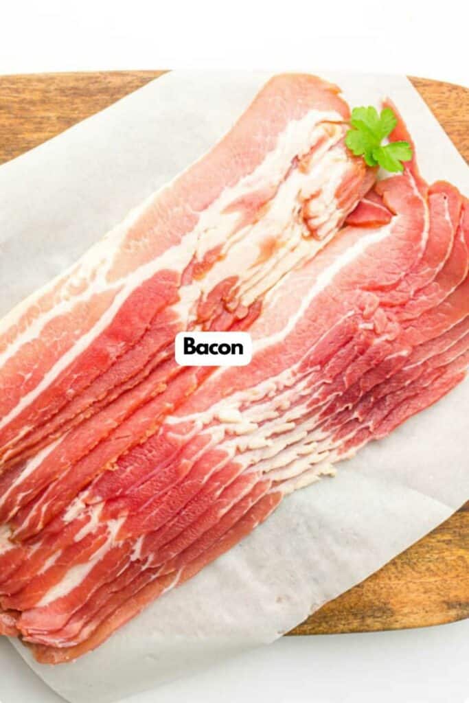 Air Fryer bacon strips on parchment paper, labeled "bacon" with a garnish of parsley.