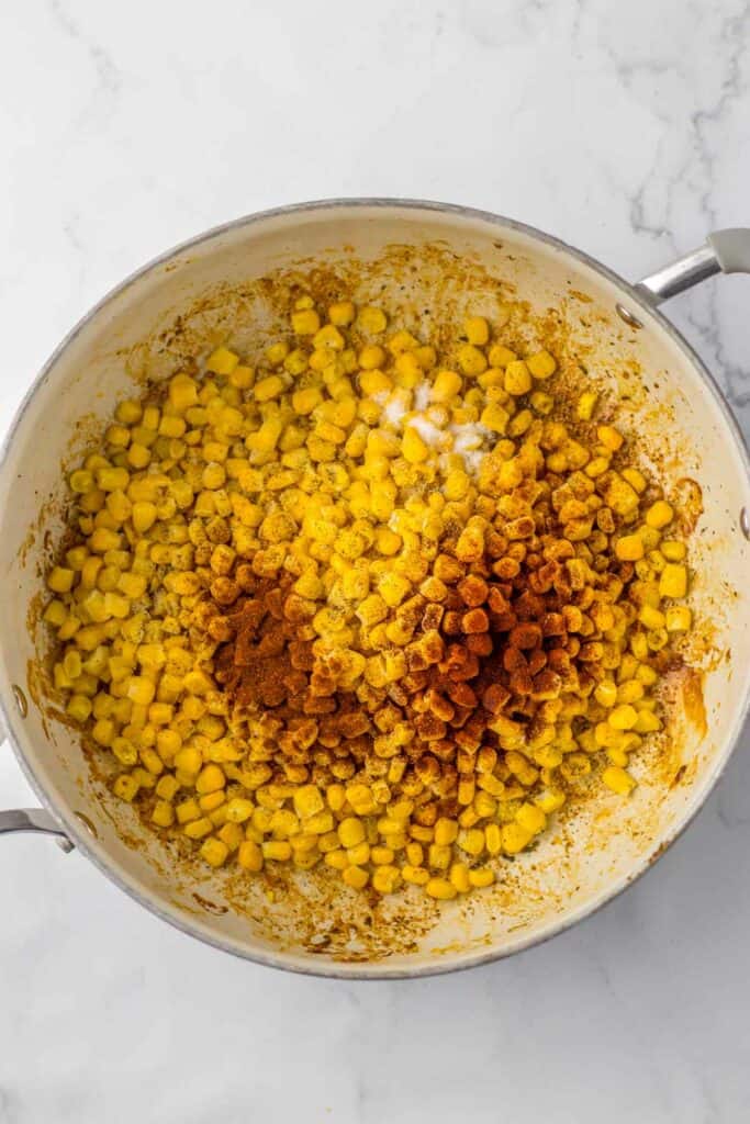 A pot containing corn seasoned.