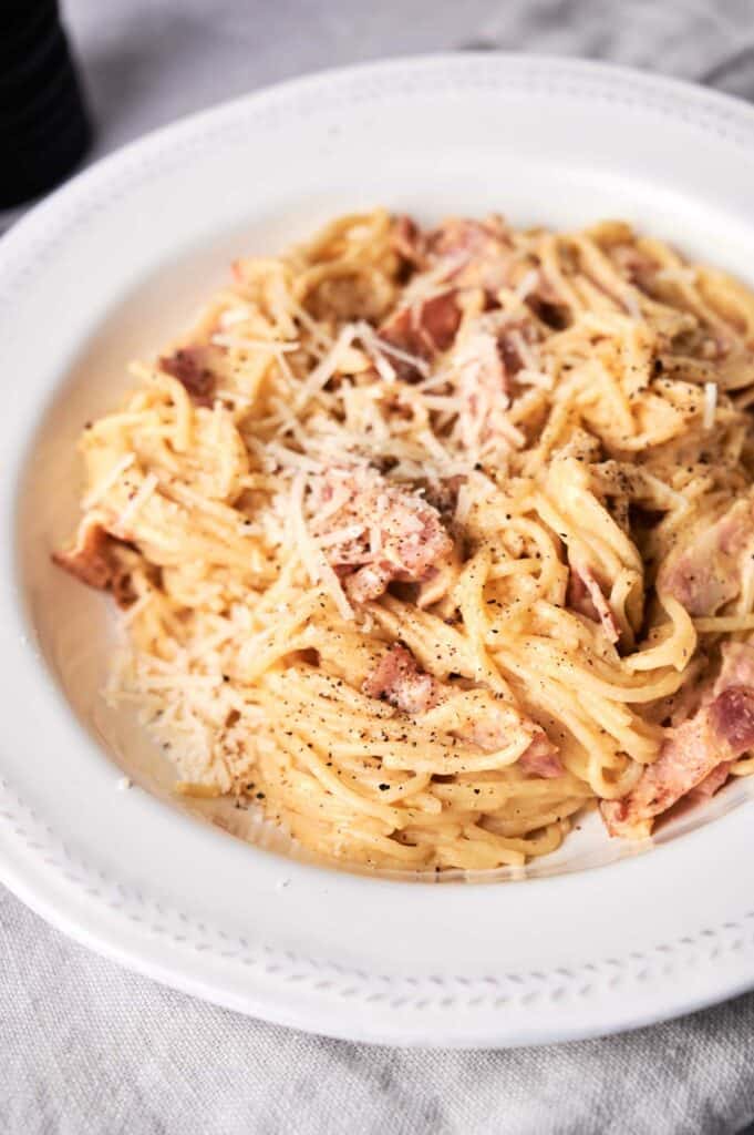 Pasta carbonara in a white plate.