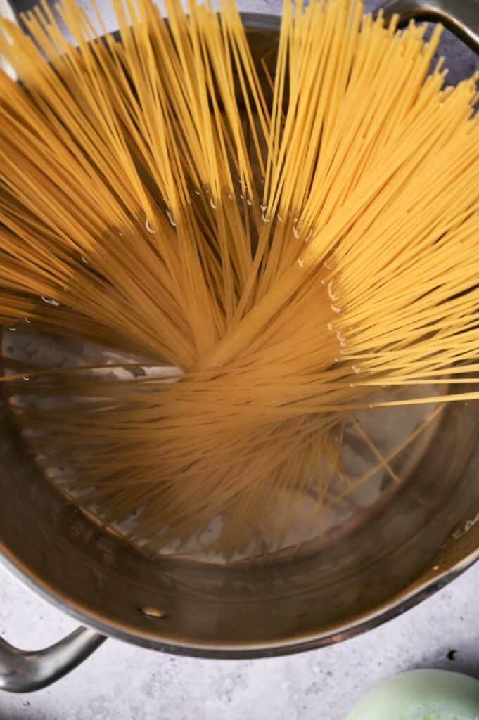 Spaghetti being cooked in a bowl.