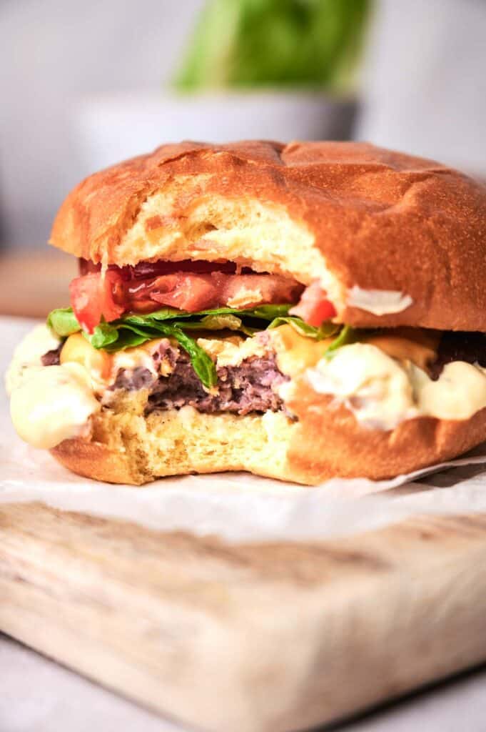 smashed burger with a small bite