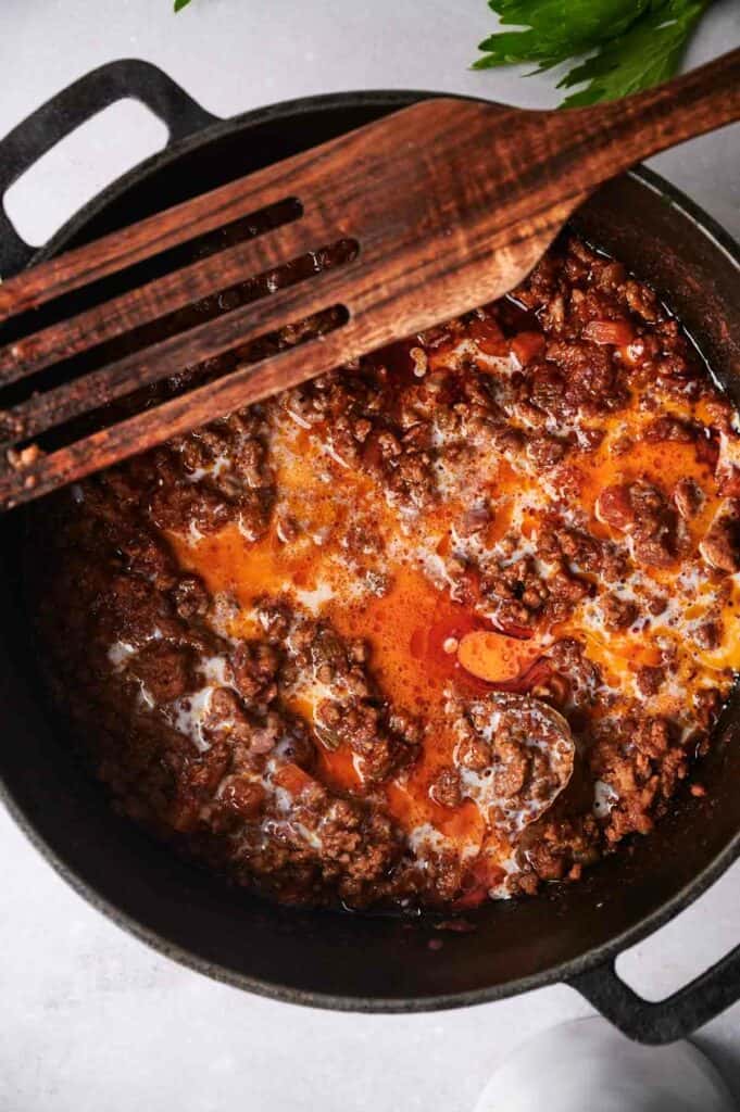 Tomato sauced in a skillet with beef.