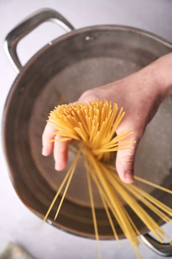 Spaghetti cooked in a pot with boiling water.