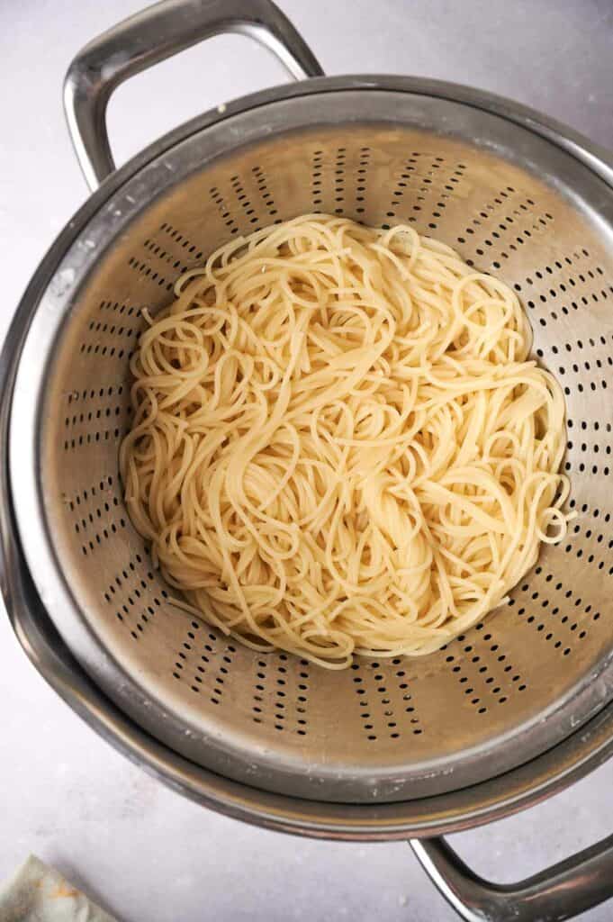Spaghetti in a strainer.
