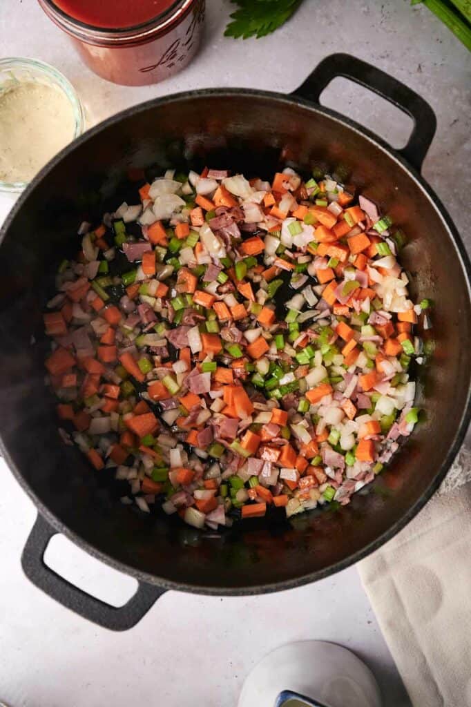 Vegetables being cooked in a skillet.