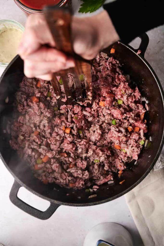 Ground beef cooked in a skillet.