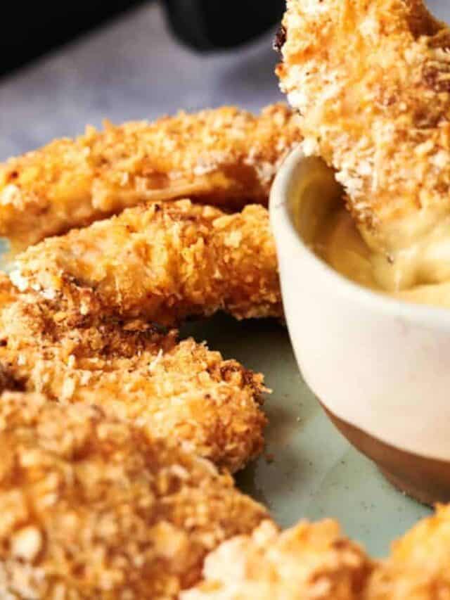 Breaded chicken tenders served with dipping sauce.
