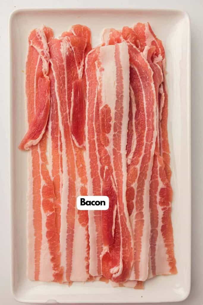 A tray with several strips of raw bacon.