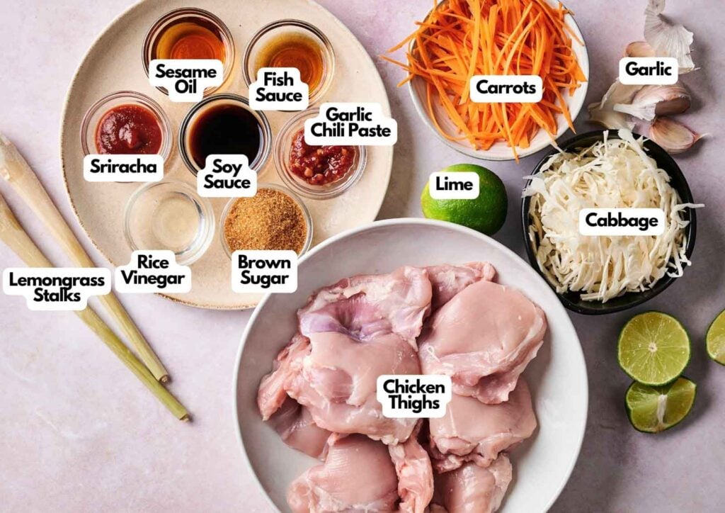 Ingredients for lemongrass chicken include chicken thighs, cabbage, carrots, lime, garlic, lemongrass stalks, rice vinegar, sriracha, soy sauce, fish sauce, sesame oil, garlic chili paste, and brown sugar.