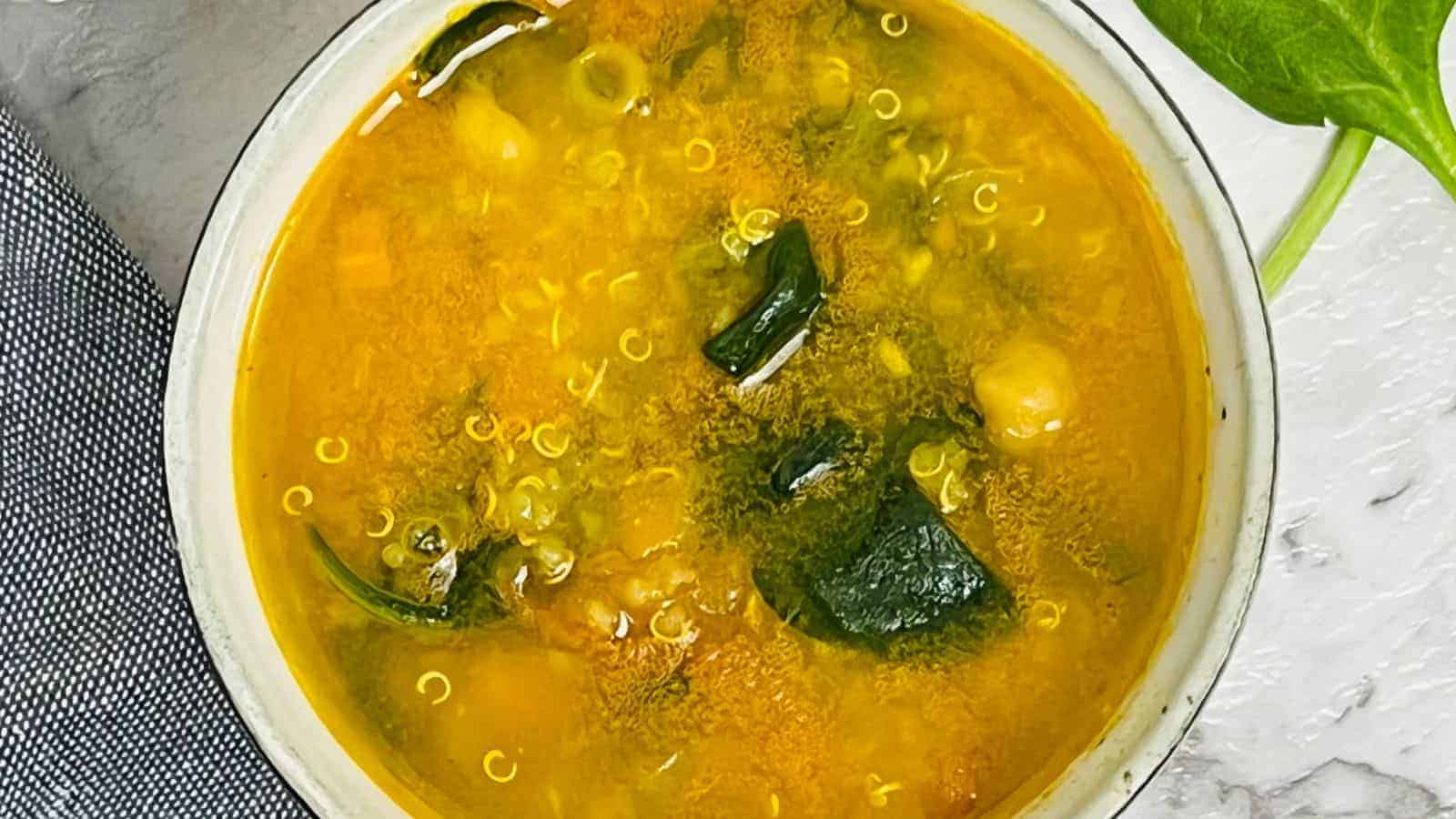 Quinoa chickpea soup in a bowl.