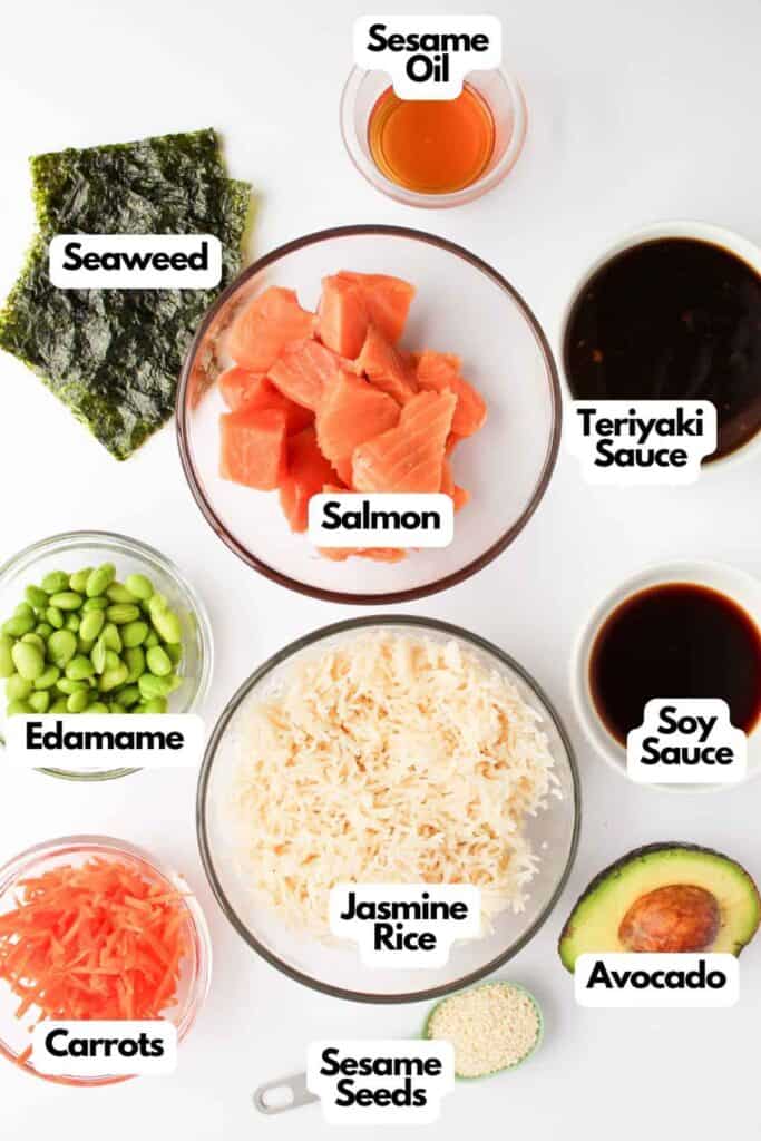 Create a delectable Teriyaki Salmon Bowl with salmon pieces, jasmine rice, and edamame, perfectly complemented by fresh avocado, crunchy carrots, and seaweed. Finished with a sprinkle of sesame seeds and drizzles of sesame oil, teriyaki sauce, and soy sauce for an irresistible flavor.