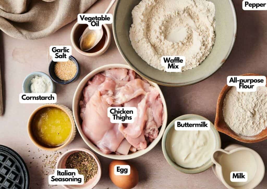 A top-down view of labeled ingredients for Chicken and Waffles, including chicken thighs, waffle mix, all-purpose flour, buttermilk, milk, egg, Italian seasoning, and more.