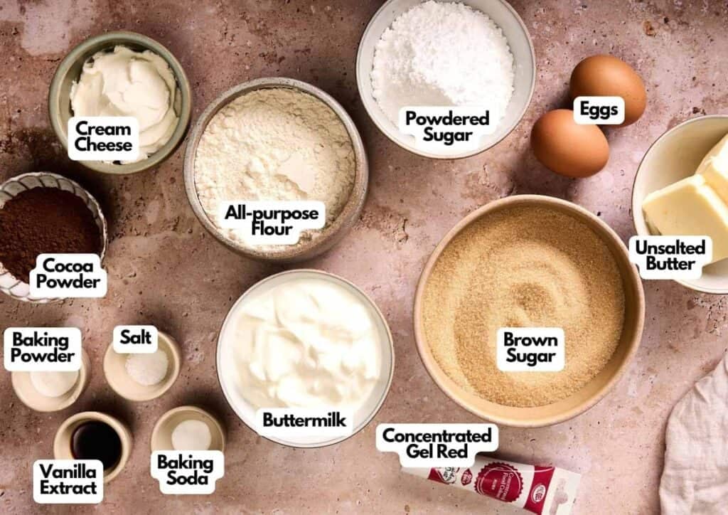 Various baking ingredients, such as cream cheese, flour, cocoa powder, and red gel, perfect for making Air Fryer Red Velvet Cupcakes with a rich flavor and tender crumb.