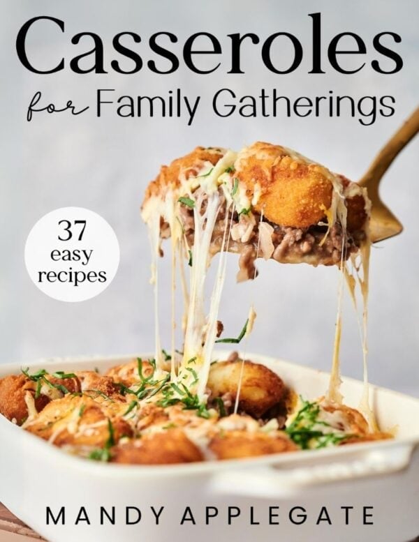 A baked casserole with melted cheese being served from a dish; text reads "Casseroles for Family Gatherings, 37 easy recipes, Mandy Applegate.