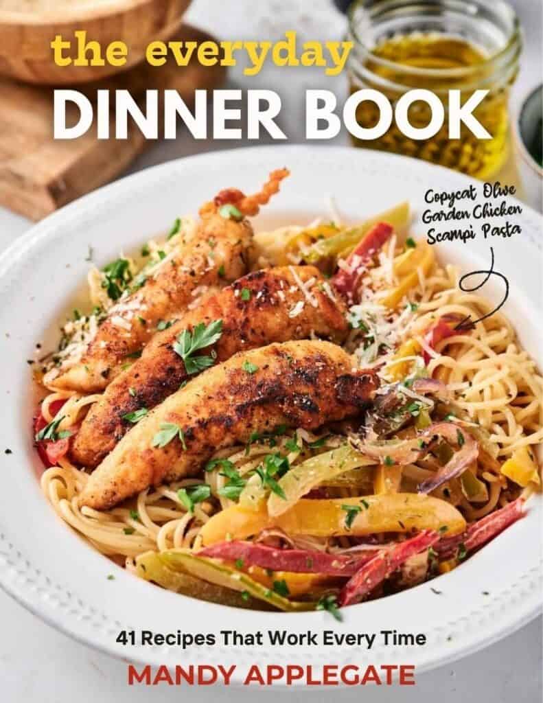 A plate of pasta with grilled chicken strips and vegetables on the cover of "The Everyday Dinner Book" by Mandy Applegate.