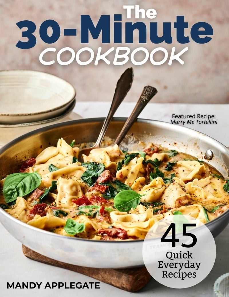 A skillet of tortellini with spinach and sun-dried tomatoes is on a table; the cover text reads "The 30-Minute Cookbook" with 45 quick recipes by Mandy Applegate.