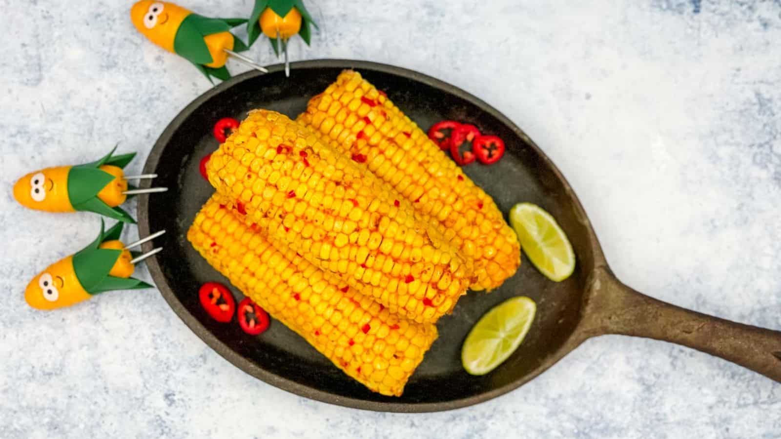 Three chili and lime corns on a skillet.